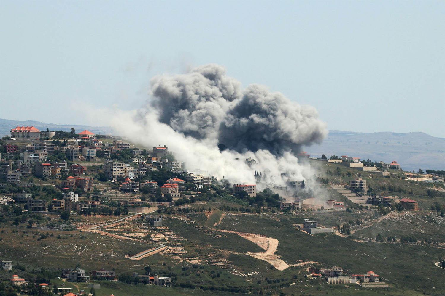 Smoke billows from the site of an Israeli airstrike on the southern Lebanese village of Khiam