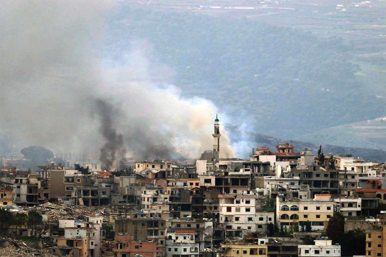 Smoke billows from the site of an Israeli strike in the southern Lebanese village of Khiam