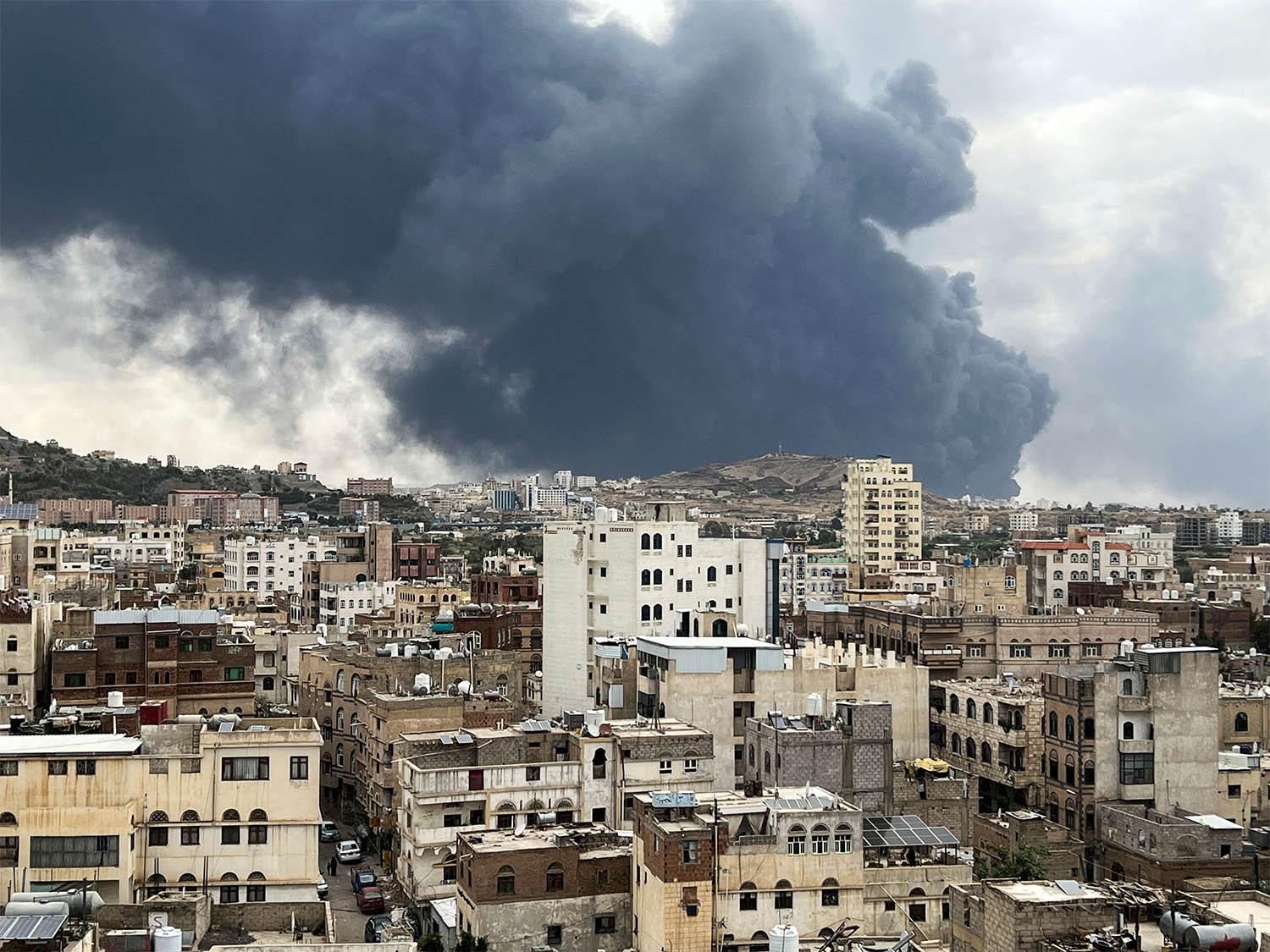 Smoke billows after an Israeli airstrike on Houthi infrastructure, in Sanaa