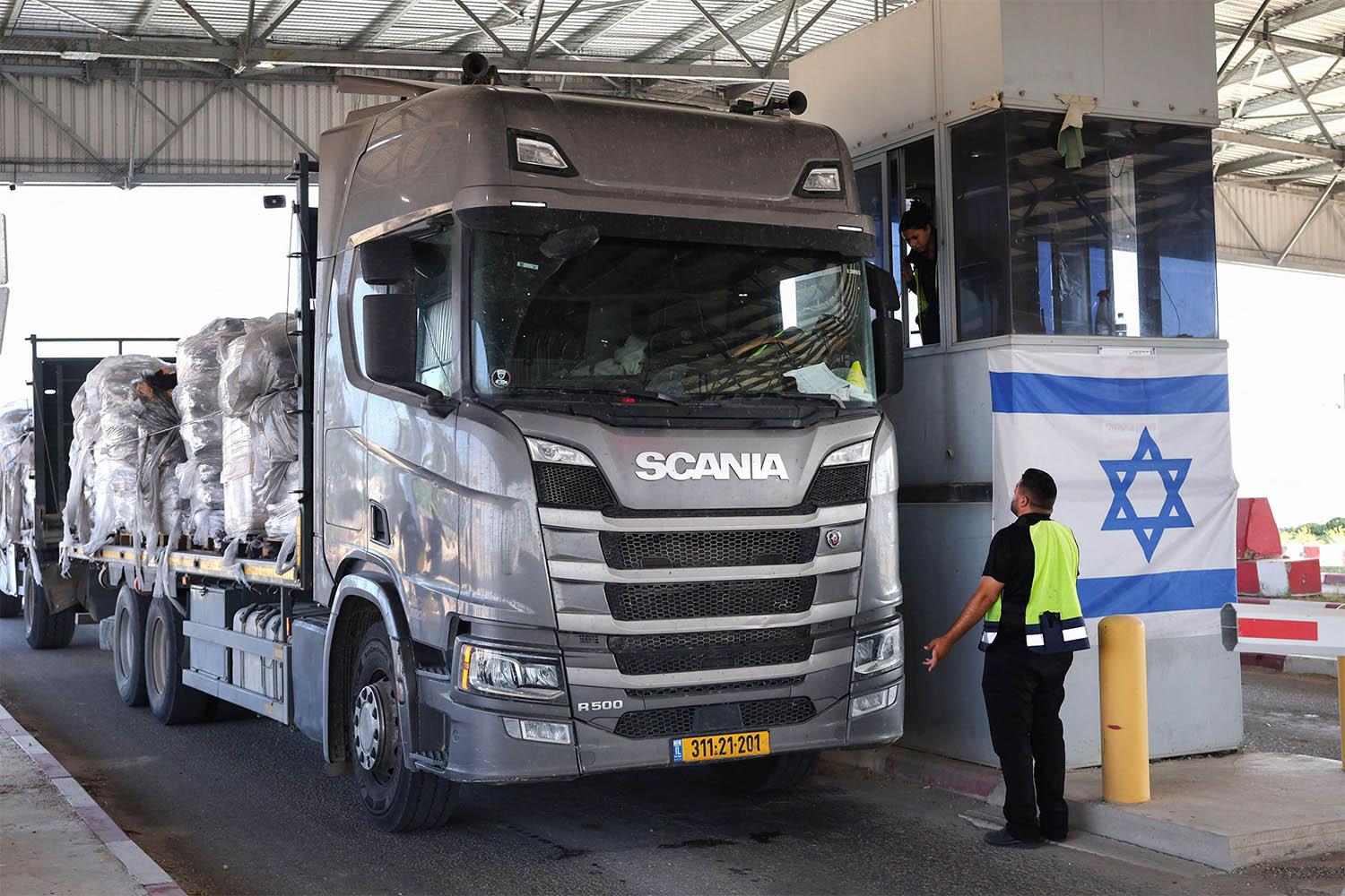 A trucks carrying humanitarian aid drives through the Kerem Shalom crossing 