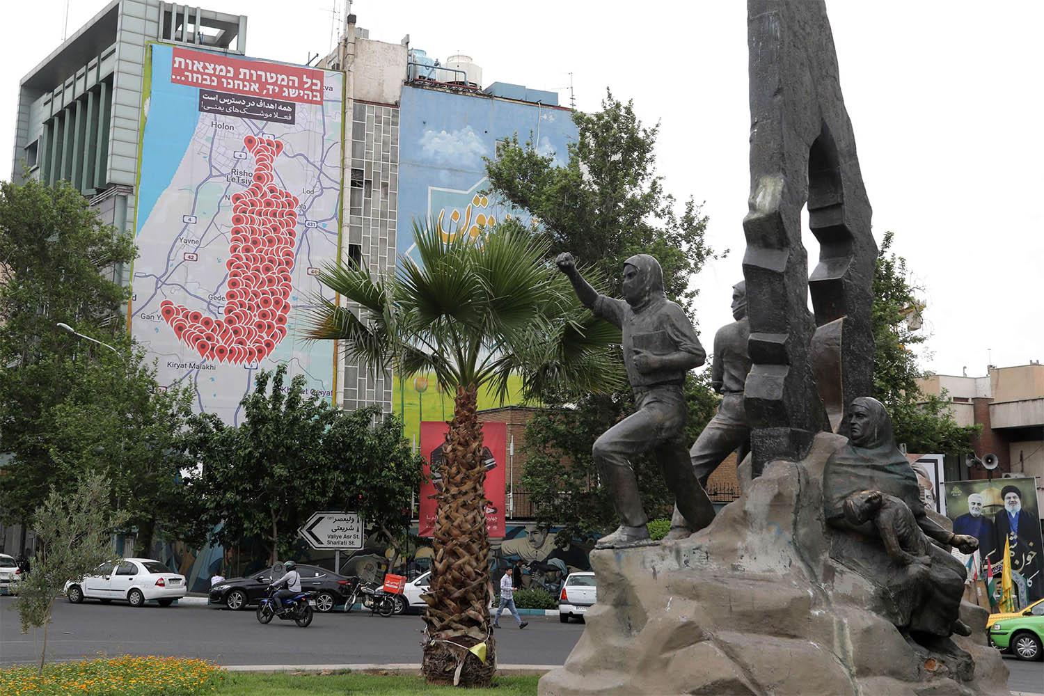 An anti-Israel billboard featuring the shape of a traditional Yemeni dagger made of map pins and sentences reading All targets in Israel are within reach