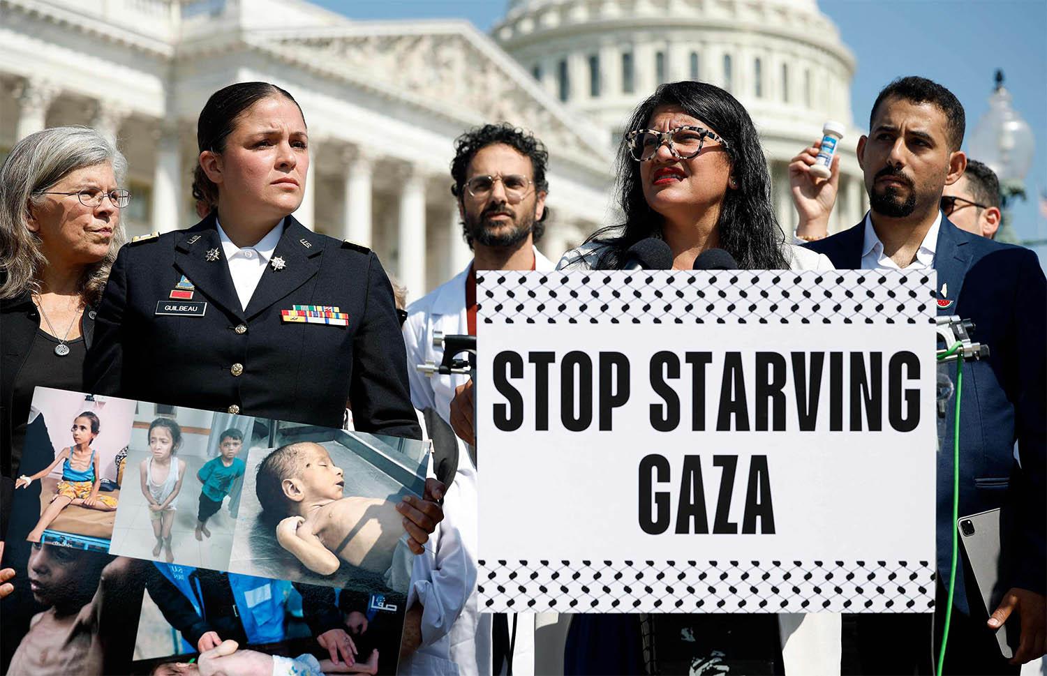 US Rep. Rashida Tlaib (D-MI), joined by Palestinian rights activists, protests for more food aid to Gaza