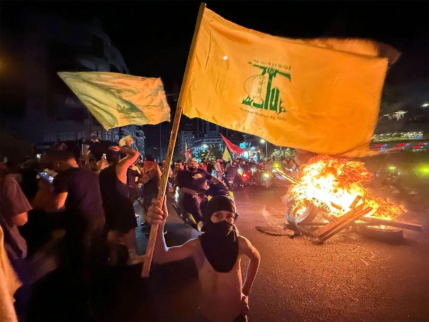 Hezbollah supporters protest against the government's decision to disarm the militant group