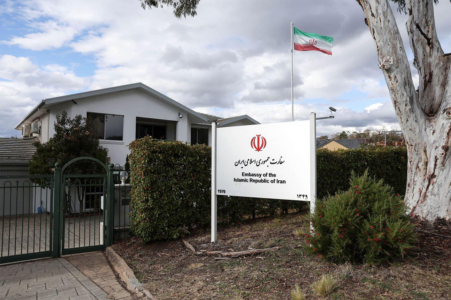 An Iranian flag flutters outside the Iran Embassy in Australia