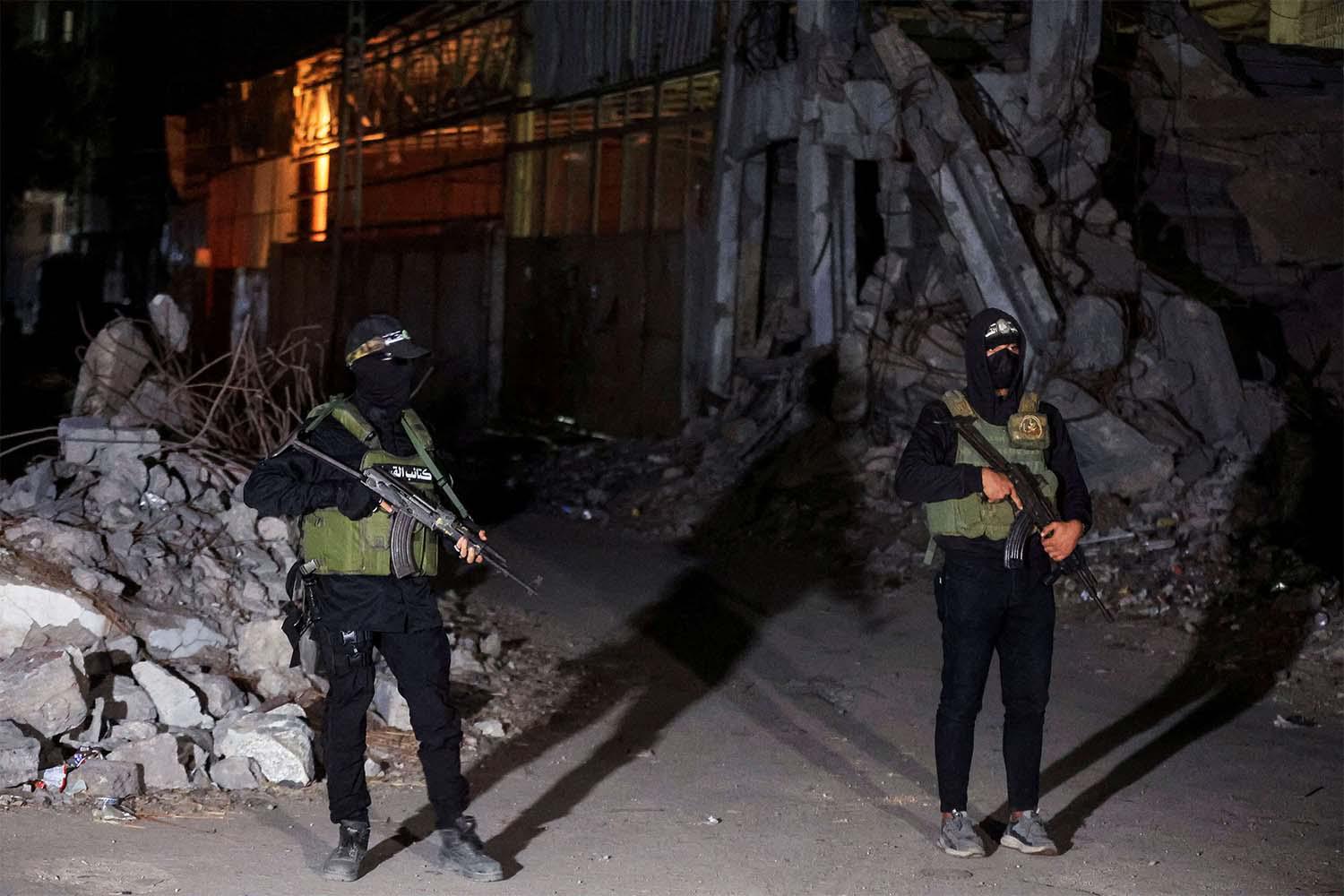 Hamas militants stand guard in Gaza