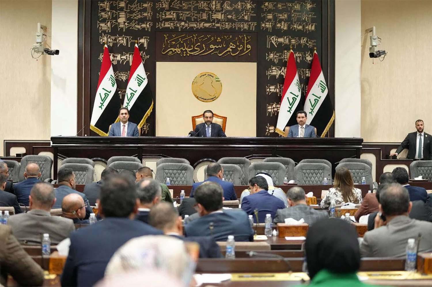 Iraqi lawmakers attend a parliamentary session
