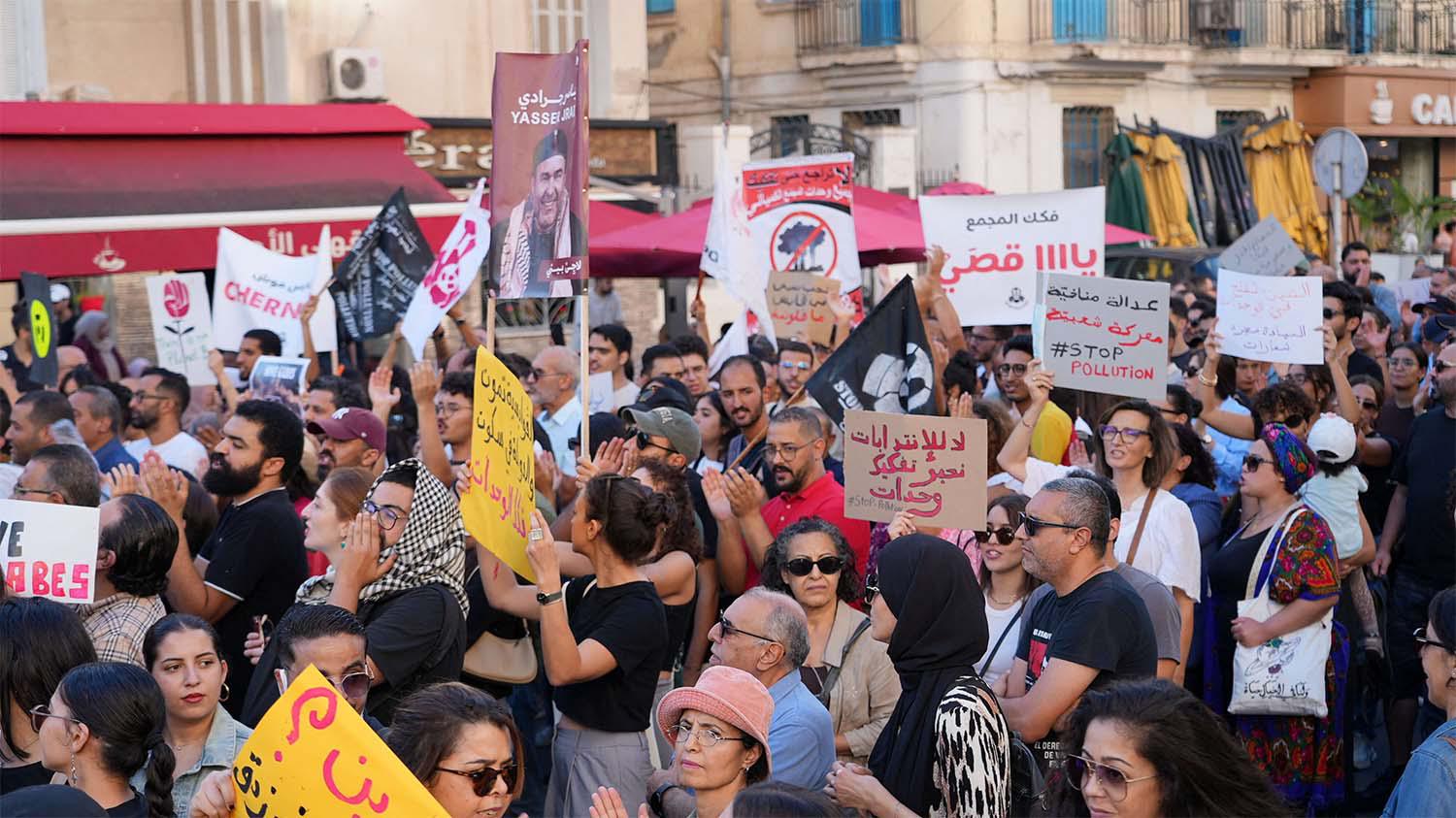 Tunisians march through Tunis to protest a severe environmental crisis caused by pollution from a state chemical plant in Gabes