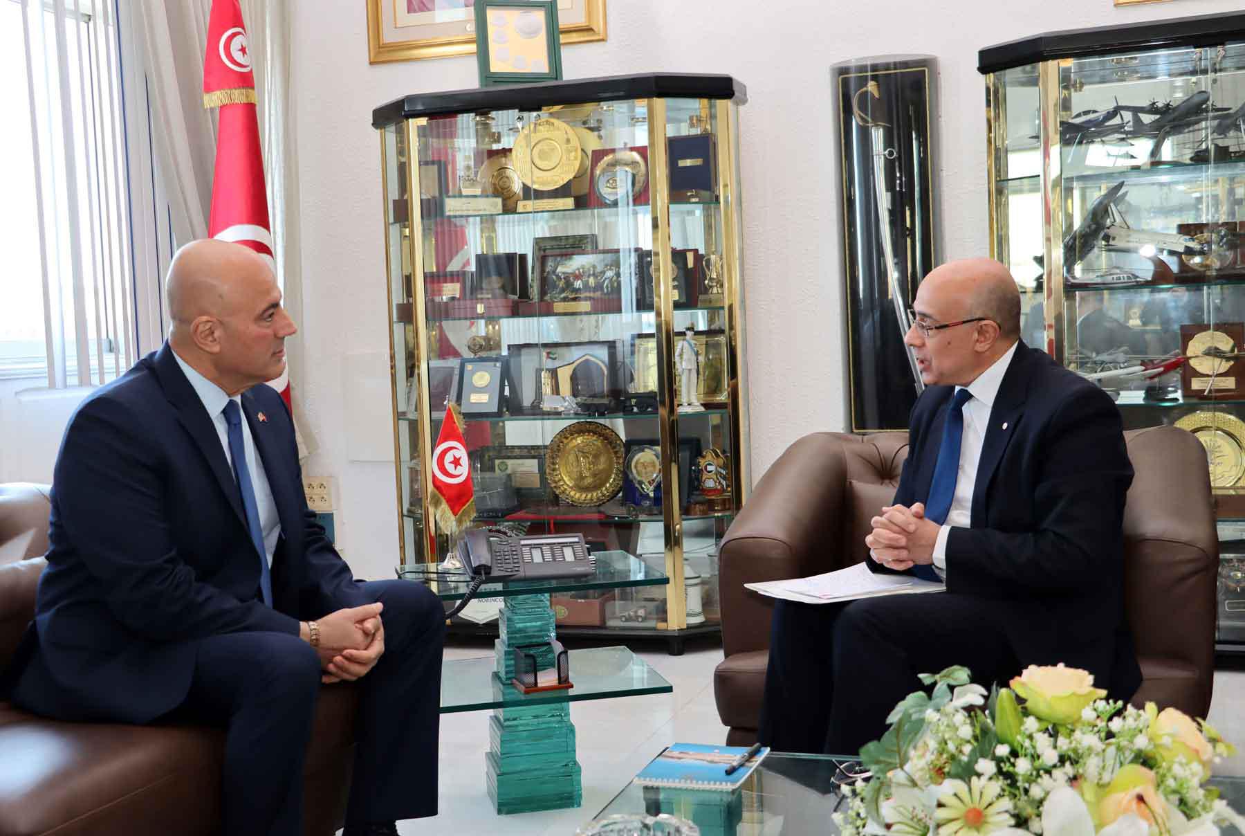Tunisian Defence Minister Khaled Sehili speaks with US Ambassador Bill Bazzi during a meeting in Tunis, December 3, 2025. 