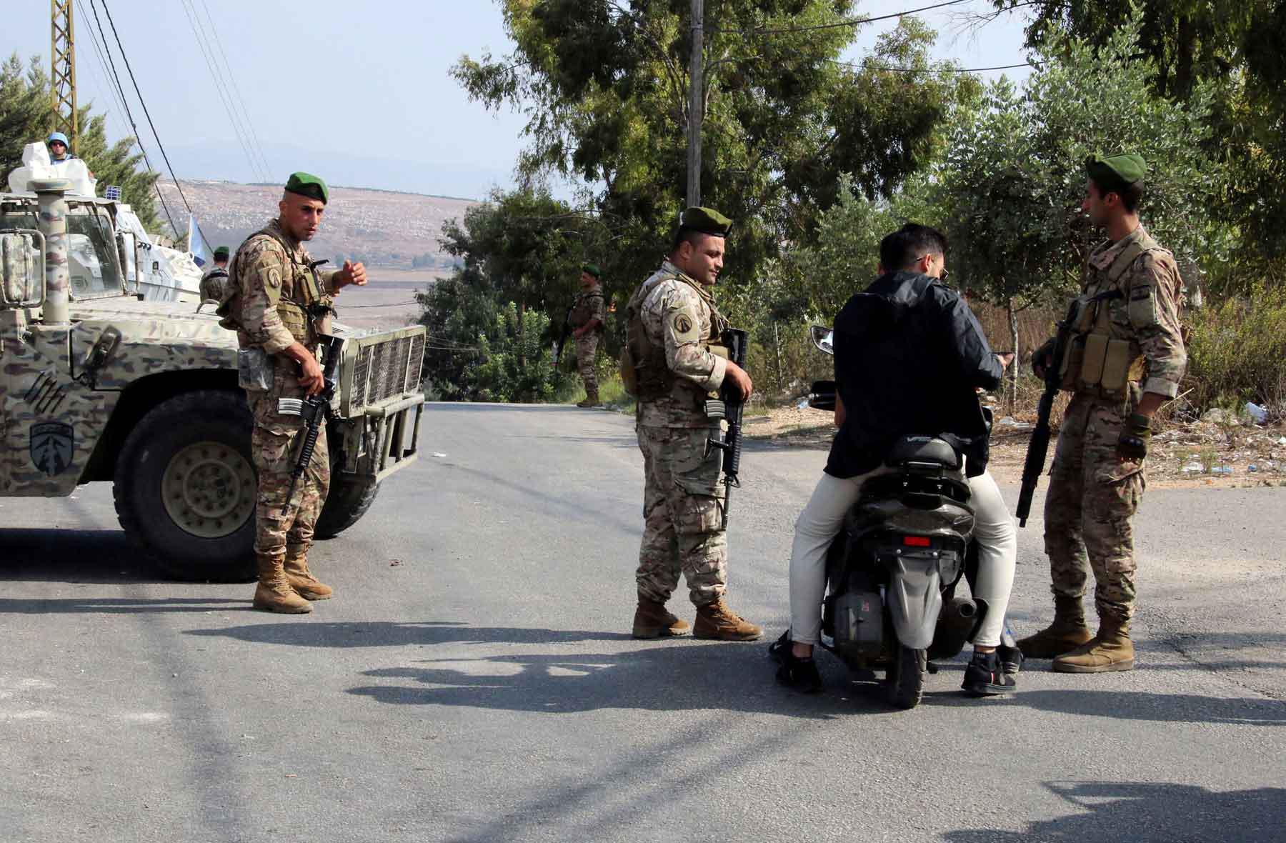Lebanese army members man a checkpoint in Marjayoun, near the border with Israel, in southern Lebanon. 
