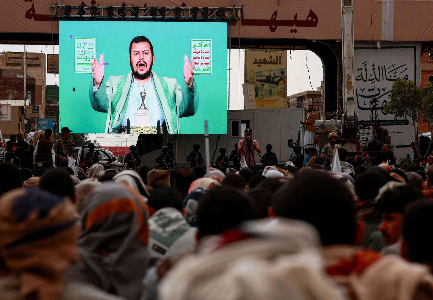 Supporters of Yemen’s Houthi movement watch a speech by the movements leader Abdul-Malik al-Houthi displayed on a big screen, during a rally in Sana’a, July 6, 2025. 