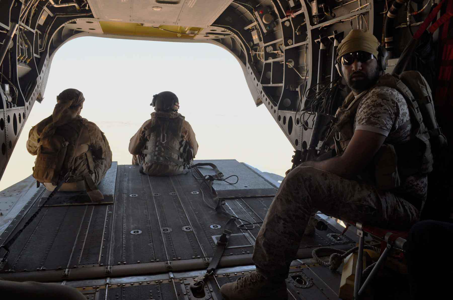 A 2015 file picture shows Emirati soldiers standing guard out the rear gate of a Chinook military helicopter travelling from Saudi Arabia to Yemen. 