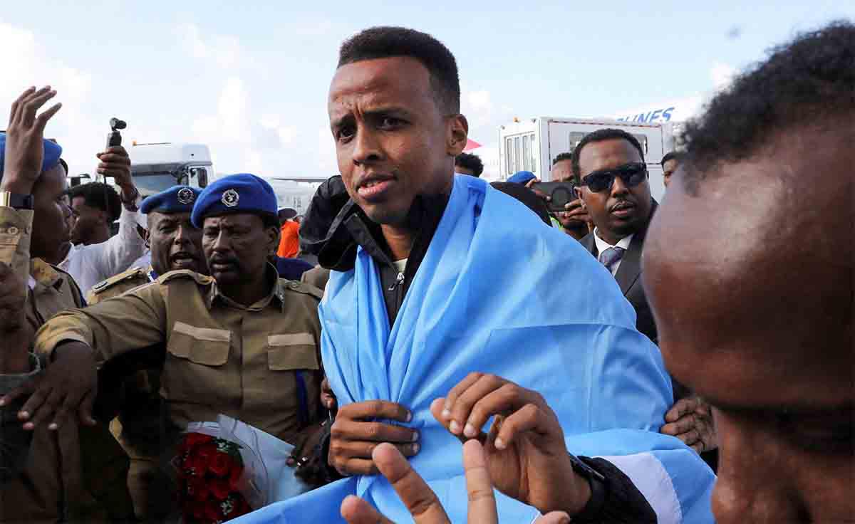 Artan is received as he arrives at the Aden Abdulle Osman International Airport in Mogadishu